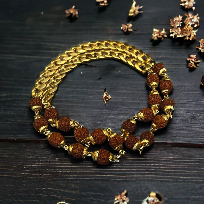 Elegant Rudraksha necklace featuring gold chain and textured beads for spiritual and fashionable appeal