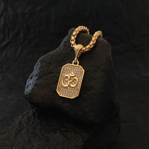 Devam Om diamond pendant necklace in gold with intricate detailing on a textured surface